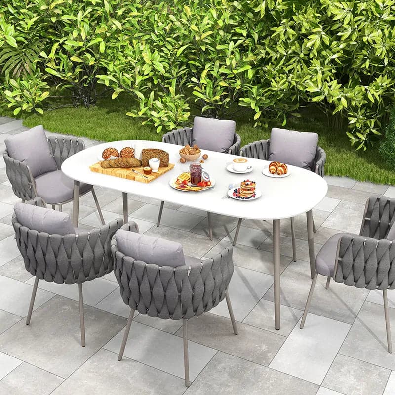 7 Pieces Outdoor Dining Set with Oval Faux Marble Top Table and Rope Woven Armchair